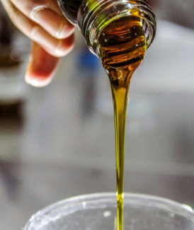 person-holding-clear-drinking-glass-with-brown-liquid.jpg person holding clear drinking glass with brown liquid